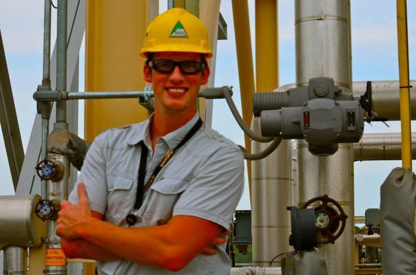 Miles Hayes in a hard hat at a mechanical plant